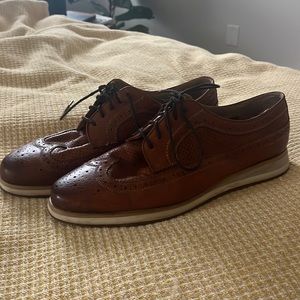 Dress shoes with rubber comfy bottoms.